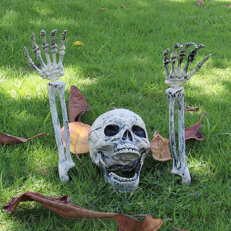 Halloween skull and separate skeletal arm outdoor decoration