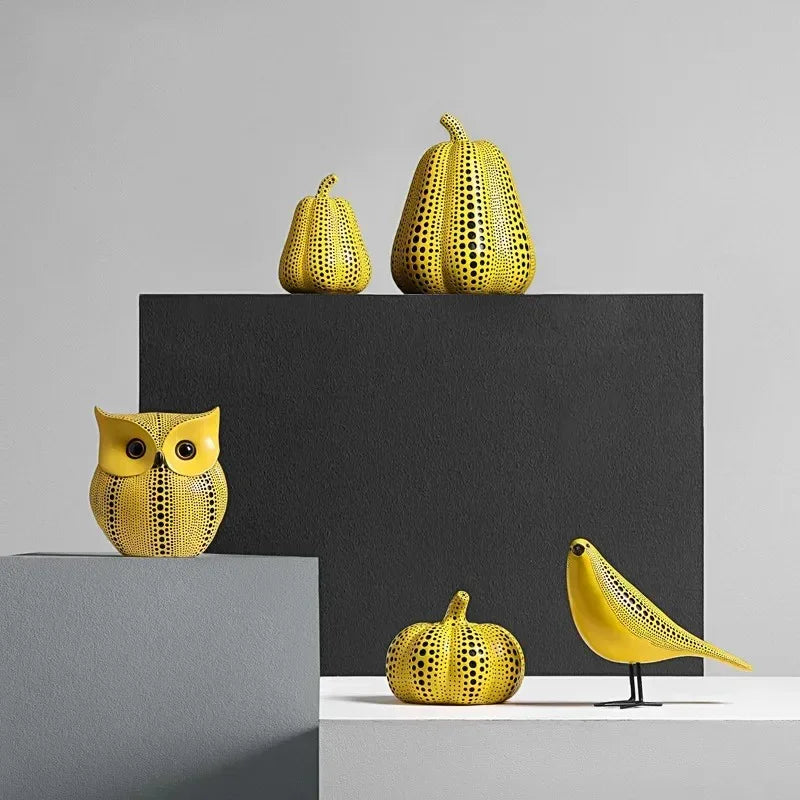 Yellow resin tabletop figurines in owl pear pumpkin and bird shapes