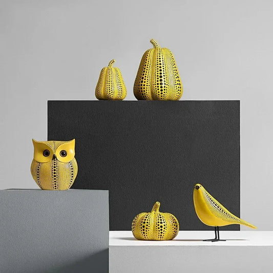 Yellow resin tabletop figurines in owl pear pumpkin and bird shapes