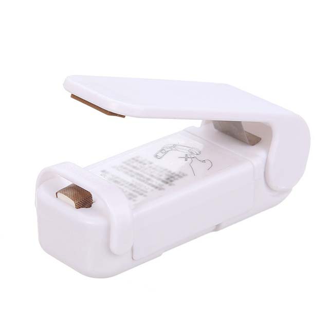 Portable handheld heat sealer for compatible food bags