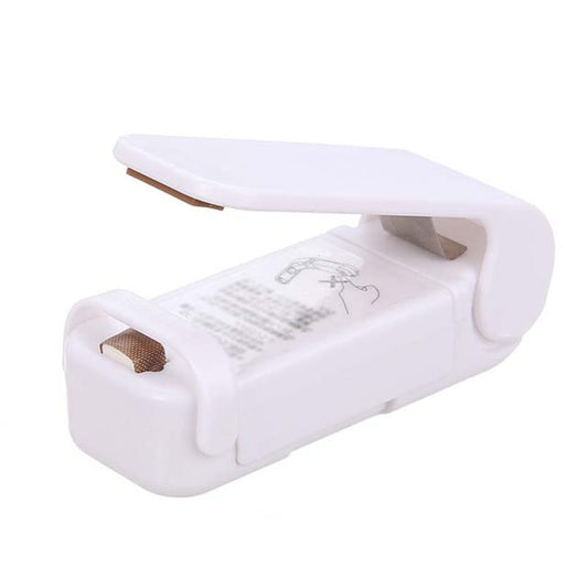 Portable handheld heat sealer for compatible food bags